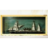 An early 20th century framed of a model steam ship.