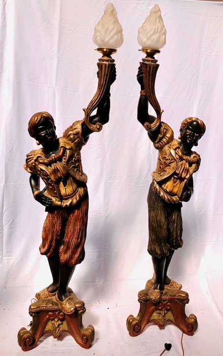A pair of late 19th Century Venetian Blackamore torchere stands, carved ebonised wood with gesso and