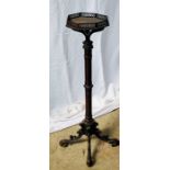 A George III mahogany torchere, circa 1780, in the manner of Thomas Chippendale, octagonal top