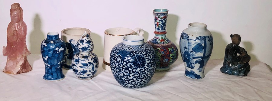 A 19th Century Chinese blue and white bombe vase with four beast mask ring handles and decorated