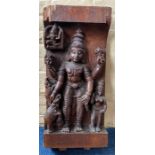 A Hindu style hardwood wall plaque