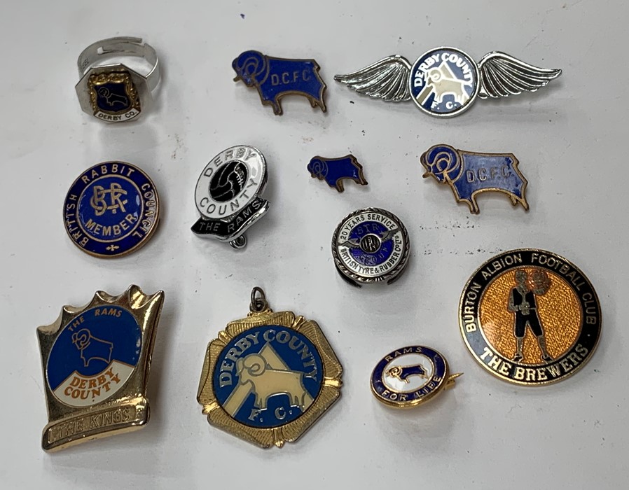 A collection of assorted football badges, mostly Derby County, also Burton Albion, together with a