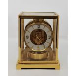 A Jaeger Le Coultre Atmos brass clock, signed to movement plate and stamped "Atmos", signed to front