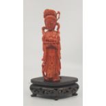 A Chinese carved coral figure: Guanyin, to white metal inlaid carved wood stand, height 18.6cm