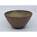 A studio pottery bowl, with olive green glazed interior, diameter 15cm.