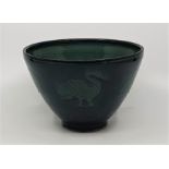 A studio pottery bowl, the side decorated repeating bird motif, green glazed, inscribed JH to base