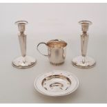 A pair of silver candlesticks, by W I broadway & Co, Birmingham 1977, with weighted bases, height