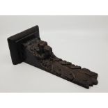 An Elizabethan oak carving, being from a tester bed, having applied printed auction catalogue