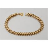 A precious yellow metal fancy link bracelet, (yellow metal assessed as 18ct. gold), length approx.