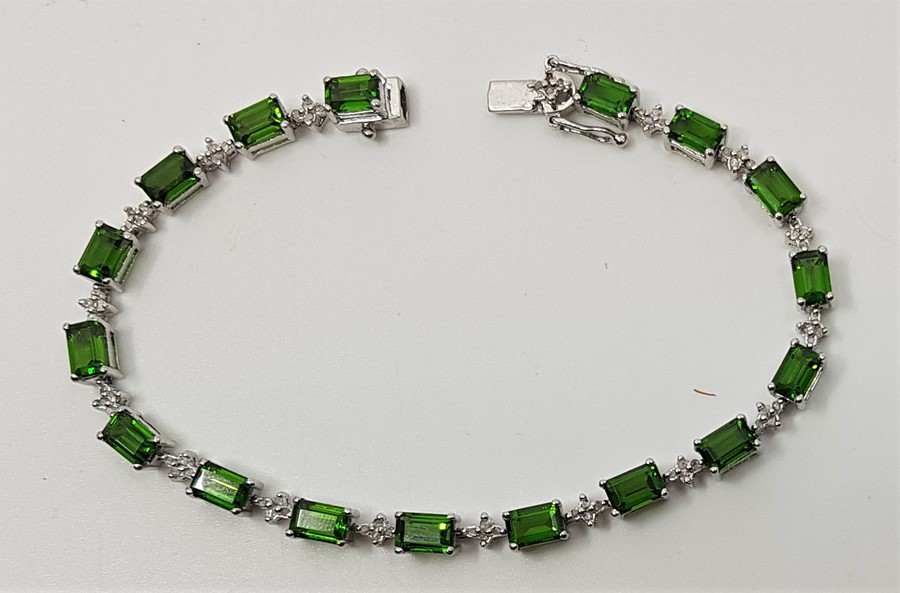 A sterling silver, diamond chip and green tourmaline set bracelet, length 19.5cm.