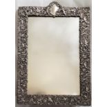 A large Victorian silver mirror frame, by William Comyns & Sons, assayed London 1897, repousse