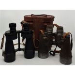WW2/Military interest: Two pairs of WW2 military binoculars, to include: A pair of Bino.Prism.No.5