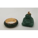A 14ct. gold and green stone ring, together with a carved green stone pendant of Hotei/Budai, with
