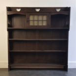 Attributed to Liberty: An Arts and Crafts oak bookshelf, having three quarter gallery and