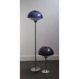 A modern standard lamp, together with a similar table lamp, having coloured perspex shades,