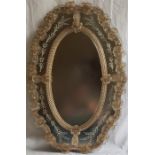 A 20th century Venetian mirror, the central oval plate bordered by four reverse etched glass