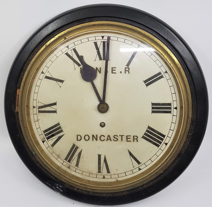 Railway interest: An LNER Doncaster wall clock, 33.5cm wide case, having white enamel Roman