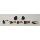 Five various 9ct. gold gem stone set rings, to include: three set garnet, a sapphire cluster ring