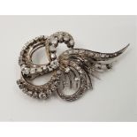 A precious white metal and diamond spray brooch, set numerous round brilliant, single and rose cut