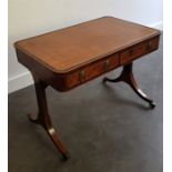 A Regency rosewood library table, having two freize drawers with two opposing dummy drawers,