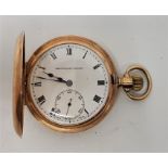 A Bravingtons Renown 9ct. gold half hunter pocket watch, crown wind, having white enamel Roman