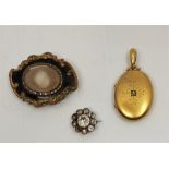 A late 19th century yellow metal and diamond oval pendant locket, set central rose cut diamond to