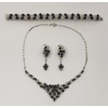 A blue sapphire and diamond fringe choker necklace, bracelet and drop earrings suite, mounted in