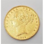 An 1869 Victoria "Young head" gold sovereign, rev. shield, die no.5.