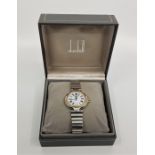 A Dunhill stainless steel wrist watch, c.1990's, quartz movement, having signed white Roman