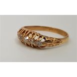 An 18ct. gold five stone diamond ring, early 20th century, set five graduated round old cut