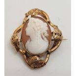 A precious yellow metal carved shell cameo brooch, (yellow metal assessed as 9ct. gold), height