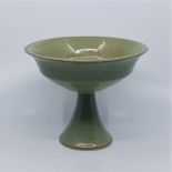 A Nevill Pottery studio pottery pedestal bowl, possibly by Olga Damaid, speckled green glaze,