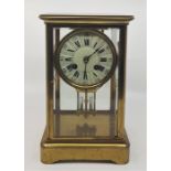 A 20th century French gilt brass mantle clock, gong strike, having circular white dial with Roman