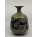 A studio pottery bottle neck vase, with flared rim, speckled grey-green ground with blue and brown