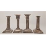A pair of silver candlesticks, by Walter Latham & Son, assayed Sheffield, with weighted bases height