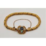 A Victorian precious yellow metal, opal and sapphire set bracelet, formed from a series of chased