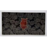 A Oriental niello white metal and carnelian agate mounted rectangular box, the sides and lid