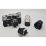 A Russian FED 4 camera, serial 6741054, with Industar-61 2.8/52mm lens, all in FED 4 leather case,