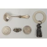 A silver plated babies rattle fashioned as a rabbit, together with a Dutch silver sauce ladle, a