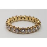 A precious yellow metal and twenty stone diamond eternity ring. set twenty round brilliant cut