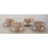 A set of four Burmese silver coffee cups and saucers, repousse foliate band, stamped to base "95%