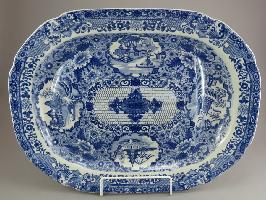 An early nineteenth century blue and white transfer-printed Spode Net pattern well and tree platter,