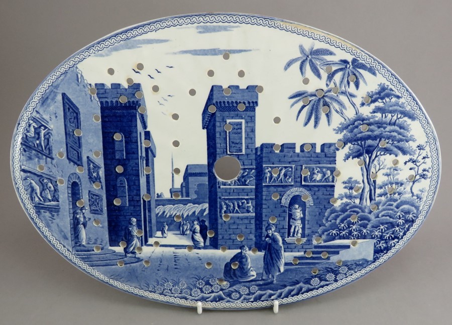 An early nineteenth century blue and white transfer-printed Spode Caramanian series oval drainer,