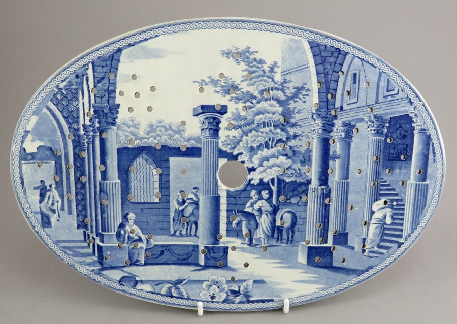 An early nineteenth century blue and white transfer-printed Spode Caramanian series oval drainer,