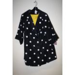 A Polka dot coat with yellow lining , size large Formally the property of the late Jessye Norman
