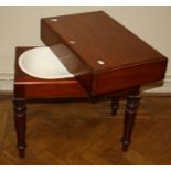 A Victorian mahogany baby's bath, with cover and kidney shape ceramic liner, on turned supports