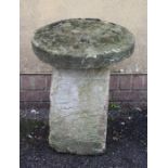 A staddle stone base and cap, 63cm high