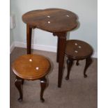 A William Brock of Exeter clover leaf shaped top cricket table, with arts and crafts style carving,