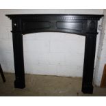 A black painted fire surround