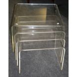 A 20th century quartetto of bent and formed lucite intersliding coffee tables. 60cm wide the largest